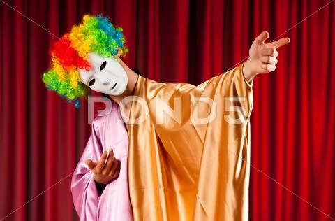 Actor with maks in a funny theater concept Stock Photos