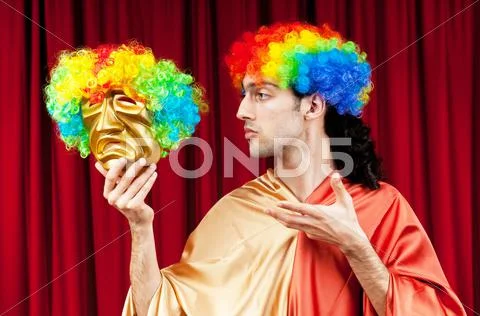 Actor with maks in a funny theater concept Stock Photos