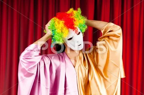 Actor with maks in a funny theater concept Stock Photos
