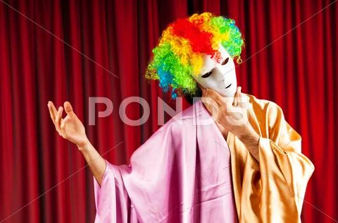 Actor with maks in a funny theater concept Stock Photos