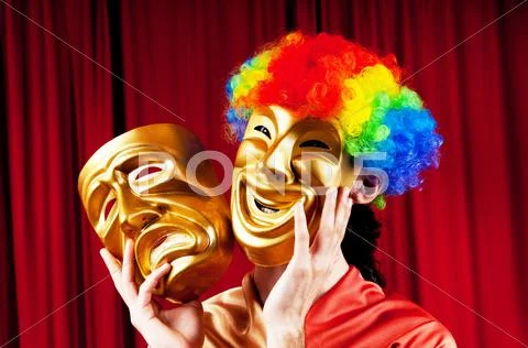 Actor with maks in a funny theater concept Stock Photos