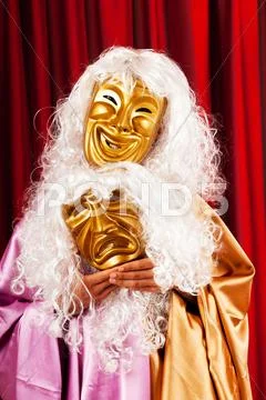 Actor with maks in a funny theater concept Stock Photos