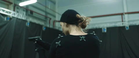 Actor in motion capture suit acting as a game or animation movie character Stock Footage 166139429