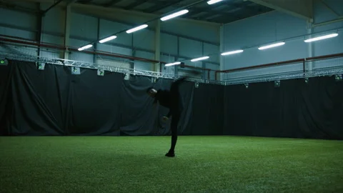 Actor in motion capture suit performing some stunt moves as a game character Stock Footage 166023696