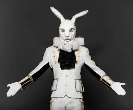 Actor posing in white rabbit suit on black background.Studio shot.Halloween time Stock Photos