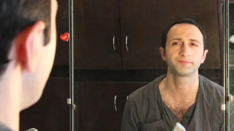 The actor is putting on himself makeup 3 Stock Footage 322071983