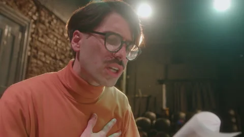 Actor Reading Play Script and Giving Speech on Theater Rehearsal Stock Footage 247796145