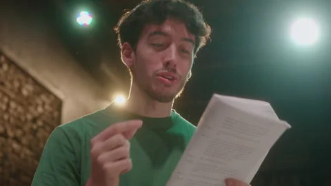 Actor Reading Script and Playing His Role on Theater Rehearsal Stock Footage 247794941