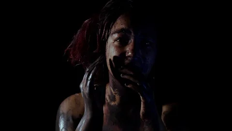 Actor rubs make up so much it comes off and looks like splattered black paint Stock Footage 123271602