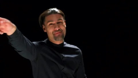 Actor speaking emotionally on stage. Stock footage. Charismatic man speaks and Stock Footage 259772005