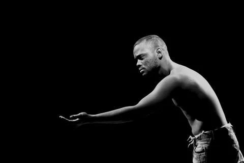 Actor on stage represents a dramatic character. Stock Photos