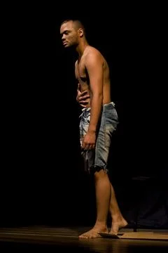 Actor on stage represents a dramatic character. Stock Photos