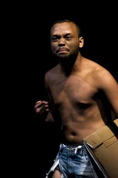 Actor on stage represents a dramatic character. Stock Photos