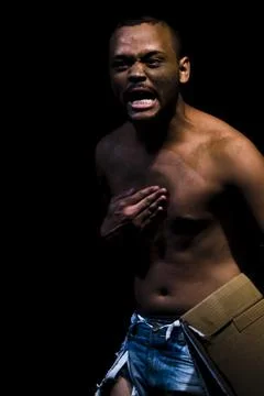 Actor on stage represents a dramatic character. Stock Photos