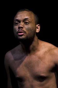 Actor on stage represents a dramatic character. Stock Photos