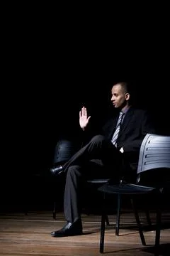 Actor on stage represents a dramatic character. Stock Photos