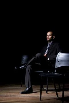 Actor on stage represents a dramatic character. Stock Photos