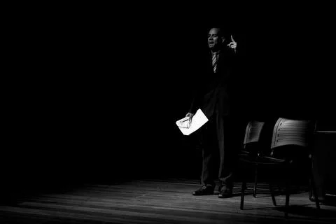 Actor on stage represents a dramatic character. Stock Photos