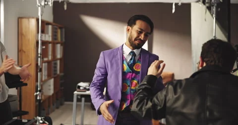 Actor, teamwork and handshake with man on set for movie deal, director approval Stock Footage 312378132