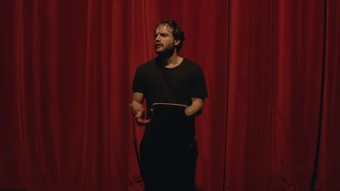 Actor in a theatre reviewing the script 스톡 동영상 108189155