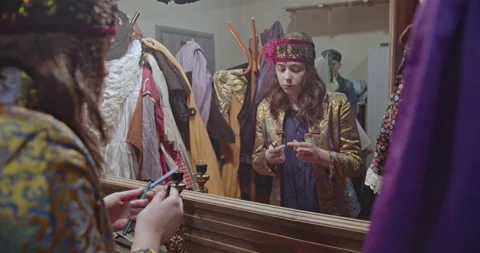Actors Applying Makeup and Getting Dressed in Costumes Backstage Before a Stock Footage 312058669