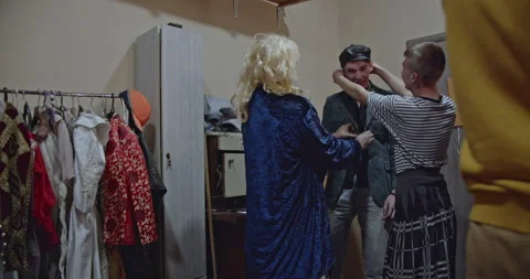 Actors Backstage: Preparing Costumes, Wigs, and Discussing Roles Before Theater Stock Footage 313084882