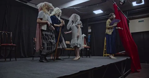 Actors in Costumes Rehearse a Play on a Theater Stage with Props, Showcasing Stock Footage 312063653