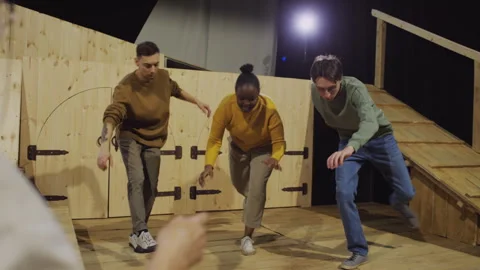 Actors Doing Balance Exercise on Theatre Stage during Acting Class Stock Footage 279591173