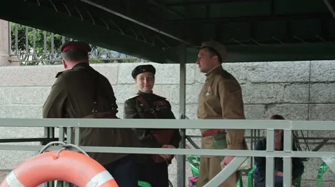 Actors Dressed As Soviet Soldiers Conversing On The Pier Video stock 64863452
