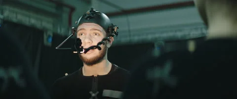 Actors in motion capture suits acting as a game or animation movie characters Stock Footage 166099557
