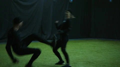 Actors in motion capture suits performing some fight moves as a game characters Stock Footage 166023129