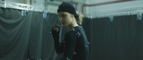 Actors in motion capture suits performing some fight moves as game characters Stock Footage 166098590