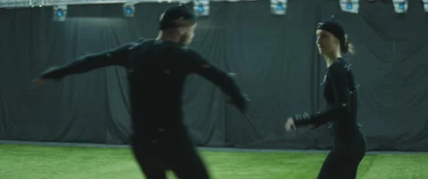 Actors in motion capture suits performing some fight moves as game characters Stock Footage 166098910