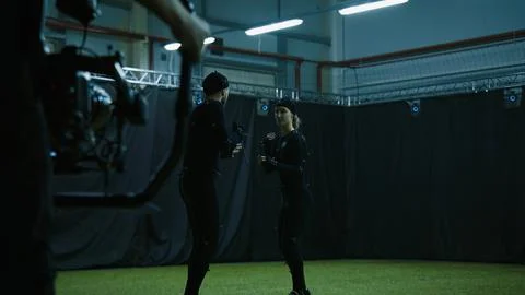 Actors in motion capture suits performing some fight moves as a game characters Stock Photos