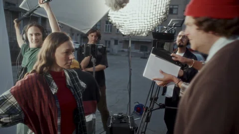 Actors Performing Emotional Argument Scene during Shoot with Film Crew Stock Footage 336702749