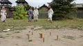 Actors plays gorodki in Kyivan Rus park, Kopachiv village, Ukraine HD Footage