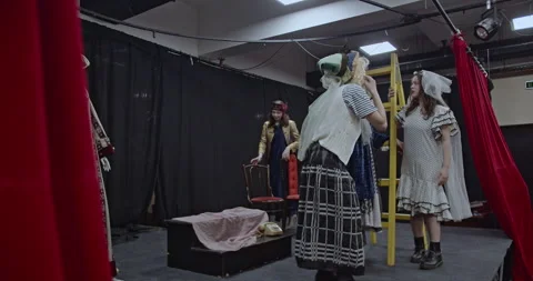 Actors Prepare Backstage: Setting up Props, Costumes, and Rehearsing on a Stock Footage 312072970