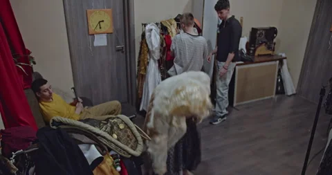 Actors Prepare Backstage, Trying on Costumes and Wigs, in the Theaters Dressing Stock Footage 312053983
