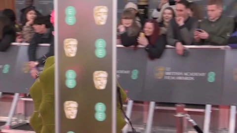 Actors walking on red carpet while wearing famous costumes at BAFTA - 2020 Stock Footage 125800405