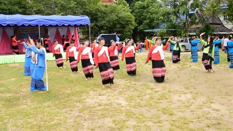 Actress dance finger nails dance with Lanna music in temple fair. Stock Footage 80597768