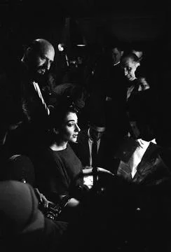 Actress Maria Callas (C) w. escort Leo Lerman (L) talking to the press after a p Stock Photos