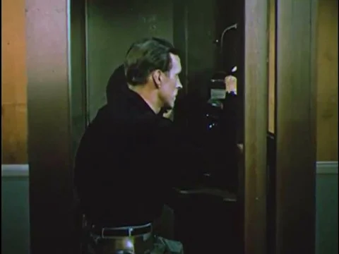 An actress uses hydraulic steering to parallel park an Oldsmobile for a scene Stock Footage 75411186