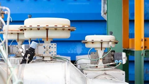 Actuator control valve installed between chemical pipelines to regulate liq.. Stock Photos