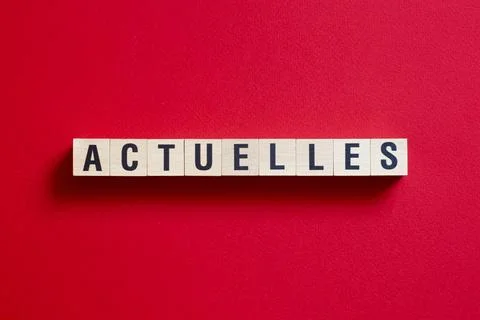 Actuelles - word concept on cubes, text, letters Stock Photos