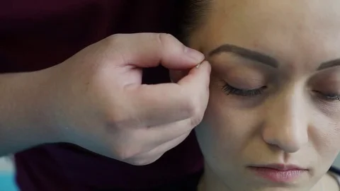 Acupuncture of the face. Stock Footage 81415525