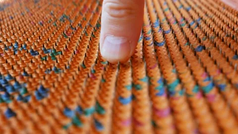 Acupuncture mat for the whole body. Sharp iron needles on a rubber sheet Stock Footage 218383532