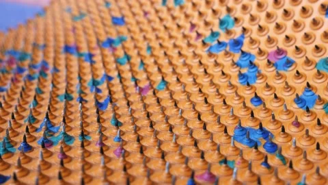 Acupuncture mat for the whole body. Sharp iron needles on a rubber sheet. Stock Footage 223399826