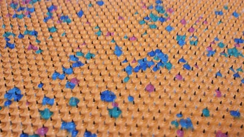 Acupuncture mat for the whole body. Sharp iron needles on a rubber sheet. Video stock 234270742