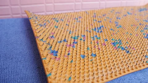 Acupuncture mat for the whole body. Sharp iron needles on a rubber sheet Video stock 236357132