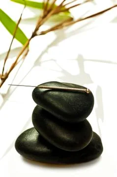 Acupuncture needle on stone Stock-Fotos